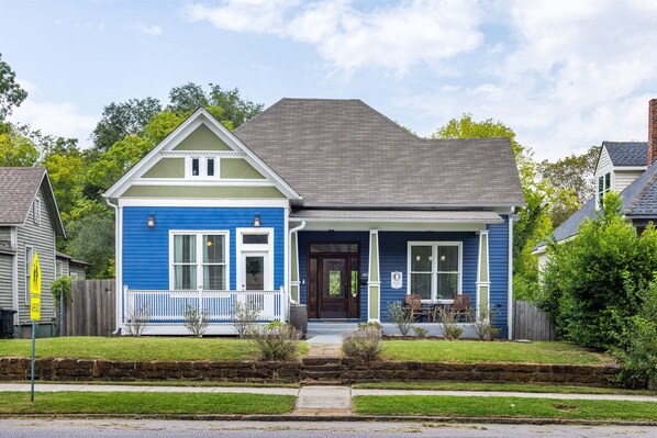 Discover our charming Birmingham Historic Home nestled in a peaceful neighborhood. The exterior boasts Southern charm with its welcoming porch and lush greenery.  Reach out to us for our personalized concierge services and handpicked local experiences. 