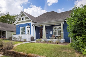 Its eye-catching blue facade stands out, exuding a sense of personality and character. This unique exterior hints at the inviting space you'll discover inside. Get in touch to explore our custom concierge services and local experiences curated just for you