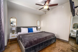 Spacious bedroom featuring a king-size bed, soft linens, and soothing neutral tones.