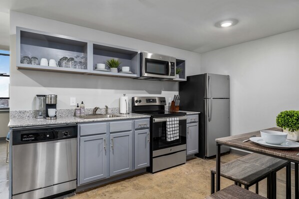 Modern kitchen with sleek cabinetry, stainless steel appliances, and ample counter space.