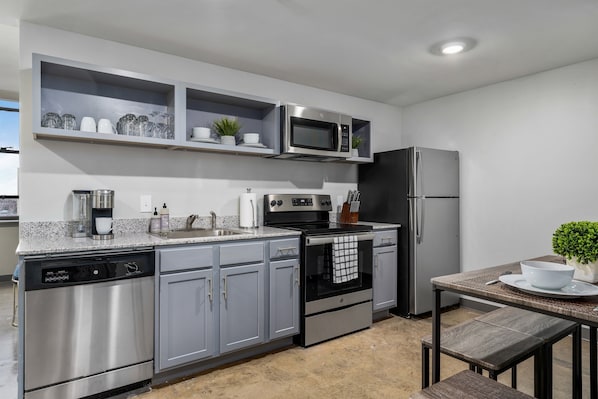 Modern kitchen with sleek cabinetry, stainless steel appliances, and ample counter space.