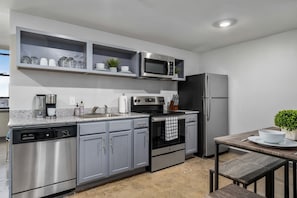 Modern kitchen with stainless steel appliances, sleek cabinetry, and ample counter space.