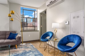 Chic seating area with bold accents and plenty of natural light for a vibrant ambiance.