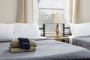 Double-queen bedroom with plenty of space, clean lines, and thoughtful decor to ensure a restful stay.