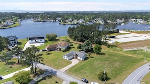 Drone view shows how close the home is to the water—visible from the porch!