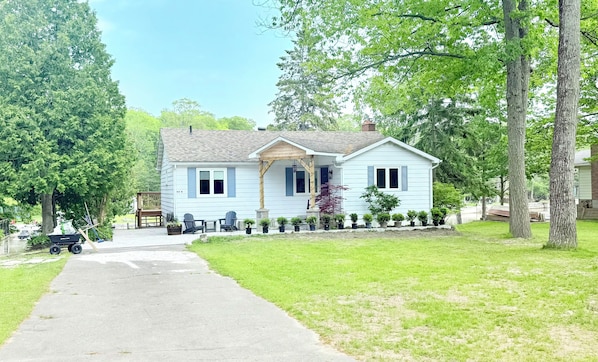 Front of house, private double lot property with 100' waterfront in backyard.