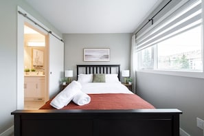 Bedroom 2 with a Queen size bed, walk in closet and ensuite