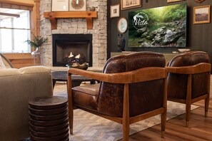 Rich textures and earthy tones make this living room feel grounded and welcoming — a cozy place to unwind or catch a movie.