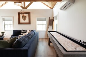 A shuffleboard table adds a touch of friendly rivalry to your stay — don’t be surprised if game night turns into a tradition.