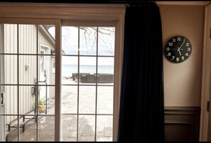 Bedroom 1 on the main floor with a walkout and facing the lake- king size bed 