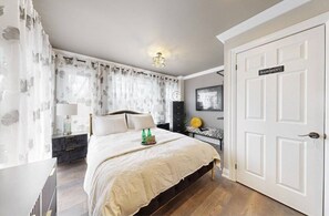 Bedroom 2 on the main floor. Queen size bed. Night stands/dresser/lingerie chest