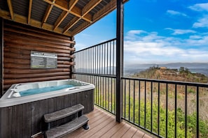 Relax in the hot tub with soothing mountain views