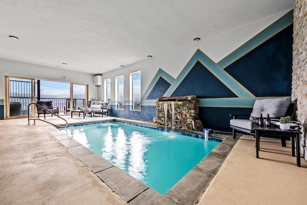 Relax and unwind in our private heated indoor pool with breathtaking mountain views!
