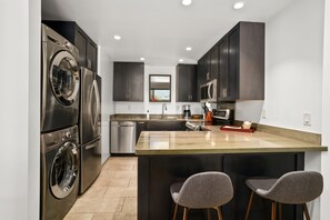 There is a Fully-equipped Kitchen with in-unit washer & dryer in 4305