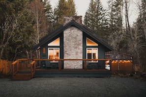 Cabin Front View - Rocking chairs & Adirondack chairs on the front deck - perfect for sipping coffee or tea as you soak up the morning sun. A peaceful start to your day in the mountains!