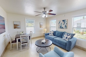 New furnishing in this inviting space with a sleep sofa and dining area.