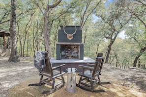 Wind down the evening and cozy up in front of an outdoor fireplace.