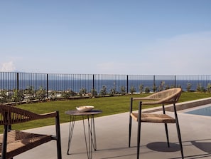 Lounge in the lap of luxury, framed by olive trees and sea breezes.