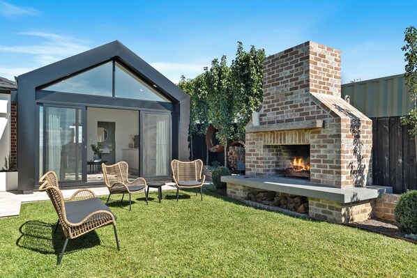 Mi Casa Su Casa - the outdoor fireplace and the studio