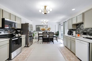 Fully equipped kitchen with high quality granite countertops. 