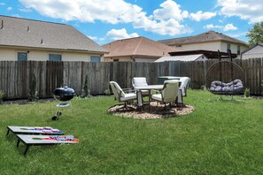 Savor the joy of cooking alfresco with our charcoal grill, creating delicious meals while enjoying quality moments with your family and friends. Plus, we include a corhole set!