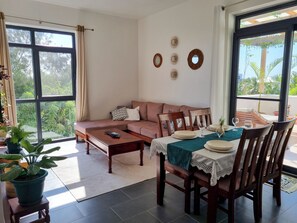 Bright aired living room doubled with intimate dining area