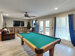 Game Room – Full-Size Pool Table, Classic Arcade Game, Corner Table With Seating for Two + Second TV Lounge Area