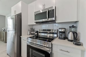 Modernized kitchen with stainless-steel appliances