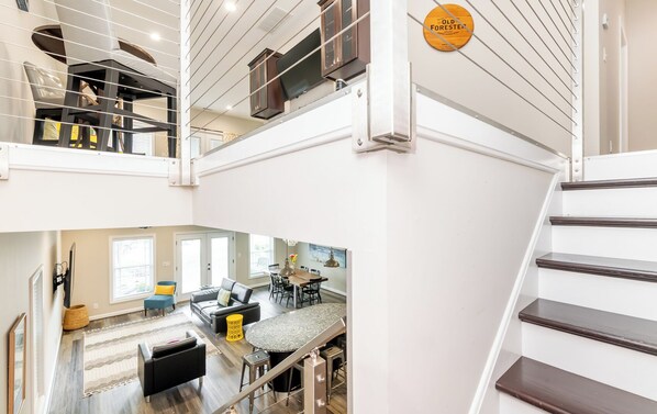 View into first floor entertaining area from stairs