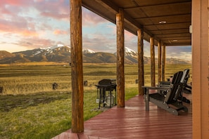 It is hard to imagine vacation getting any better than that sunset, those mountains and this porch.