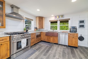 Cook in style with modern appliances and natural light through bright windows!