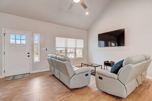Living Room with 2 very comfortable   reclining sofas. The cordless  blinds in this room can slide down from the top as well as bottom to allow for different levels of sunlight from entering and controlling your level of privacy. 