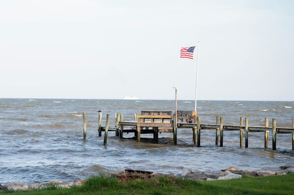 Steps from the water - this luxurious bayside cottage offers breathtaking views.
