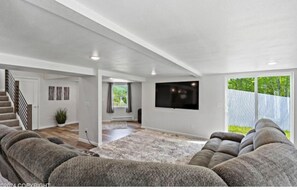 Relax in comfort with cozy seating for seven in this spacious living room.