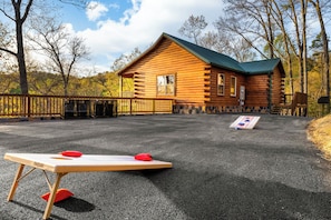 Outdoor Retreat: Enjoy friendly competition with cornhole right at your door!