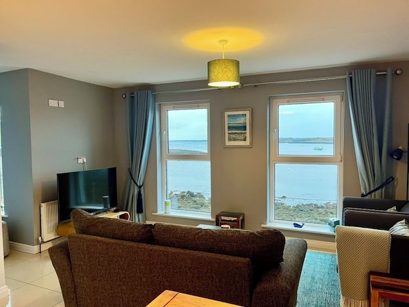 Stunning living room with uninterrupted sea views.