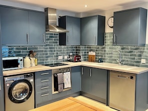 Full kitchen, recently renovated, with dishwasher and washer/dryer.