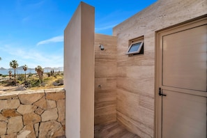 Outdoor shower by pool