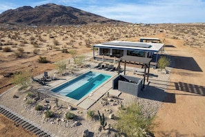 Nestled on 20 private acres of fenced-in desert, this home offers unmatched seclusion and tranquility. Perfect for stargazing, exploring, or simply unwinding in a serene setting.