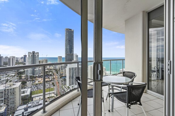 Enjoy your morning coffee in this spacious balcony overlooking the ocean/city