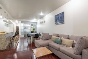 Sofa and view to the kitchen and dining room