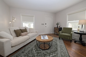Welcome to Green St. Unit A-Newly renovated-Living room with plush couch.