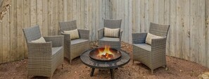 As the stars come out, the fire pit becomes the place to be—perfect for sipping something warm, roasting a treat, or simply soaking in the evening’s peace.