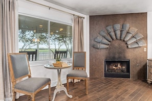 Wake to a gentle flicker or fall asleep by firelight—this gas fireplace beside the bed brings comfort and charm, setting the scene for cozy mornings and restful nights.