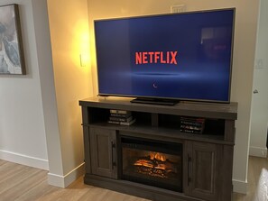 55" TV with Roku stick & a cozy fireplace