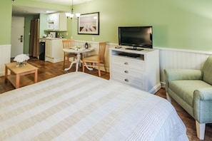 This cozy studio features a Murphy bed, sleeper sofa, and kitchenette equipped with a mini fridge, microwave, toaster, and coffee maker, perfect for couples or small families.