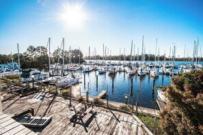 Enjoy serene riverfront views filled with sailboats, ideal for a peaceful afternoon with the family or exploring local waterfront activities.