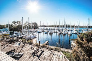 Enjoy serene riverfront views filled with sailboats, ideal for a peaceful afternoon with the family or exploring local waterfront activities.