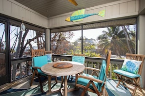 Screened Lanai with outdoor dining table