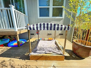 The large, new barbecue grill, hot tub and fruit trees (apple and pear)